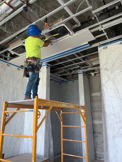 Image of person working on drywall construction, Sierra Drywall Inc,
